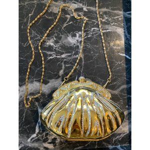 An Evening Metal Gold Clutch/Purse With a Strap.